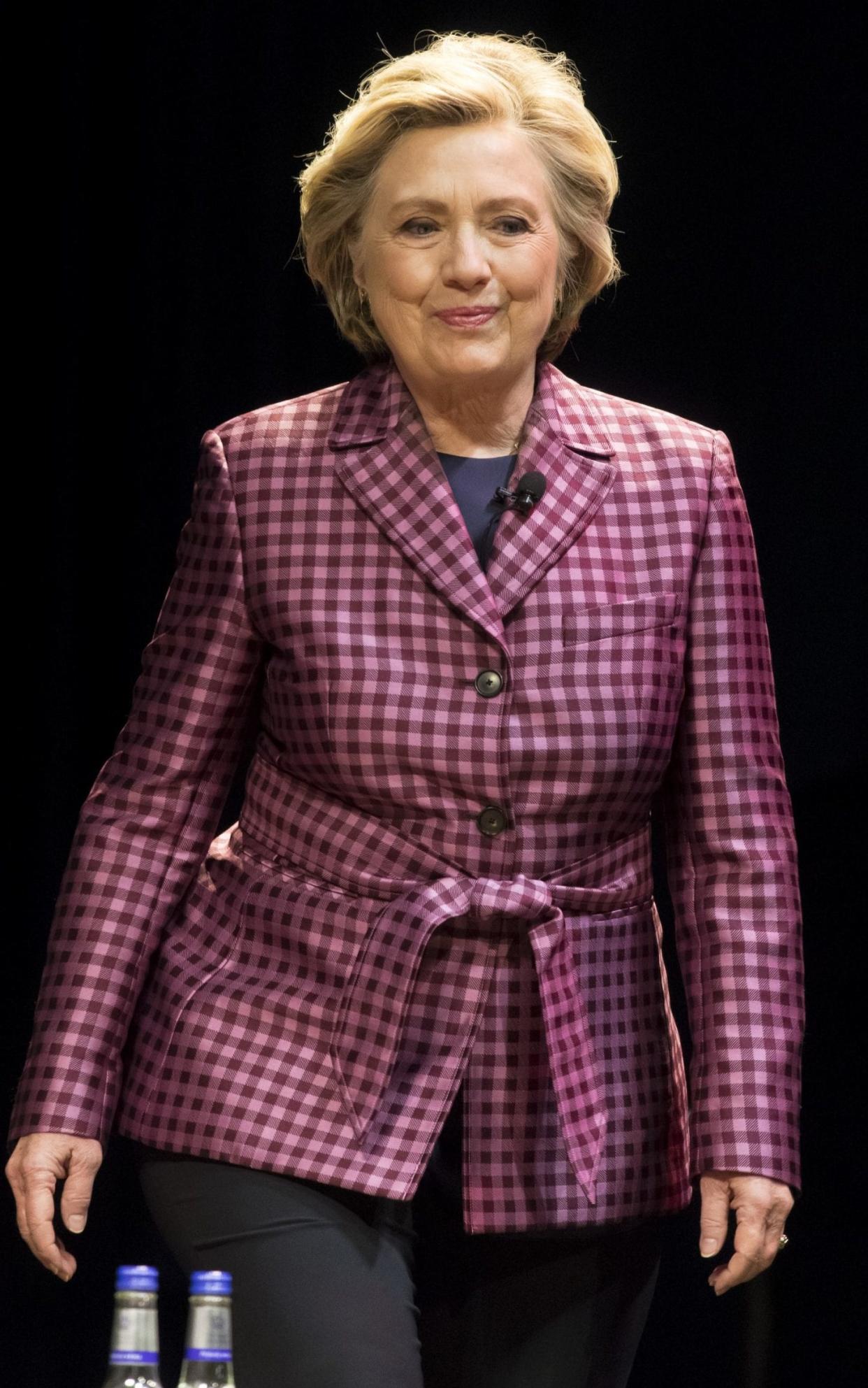 Hillary Clinton speaks at the Cheltenham Literary Festival, wearing Argent - Getty Images Europe