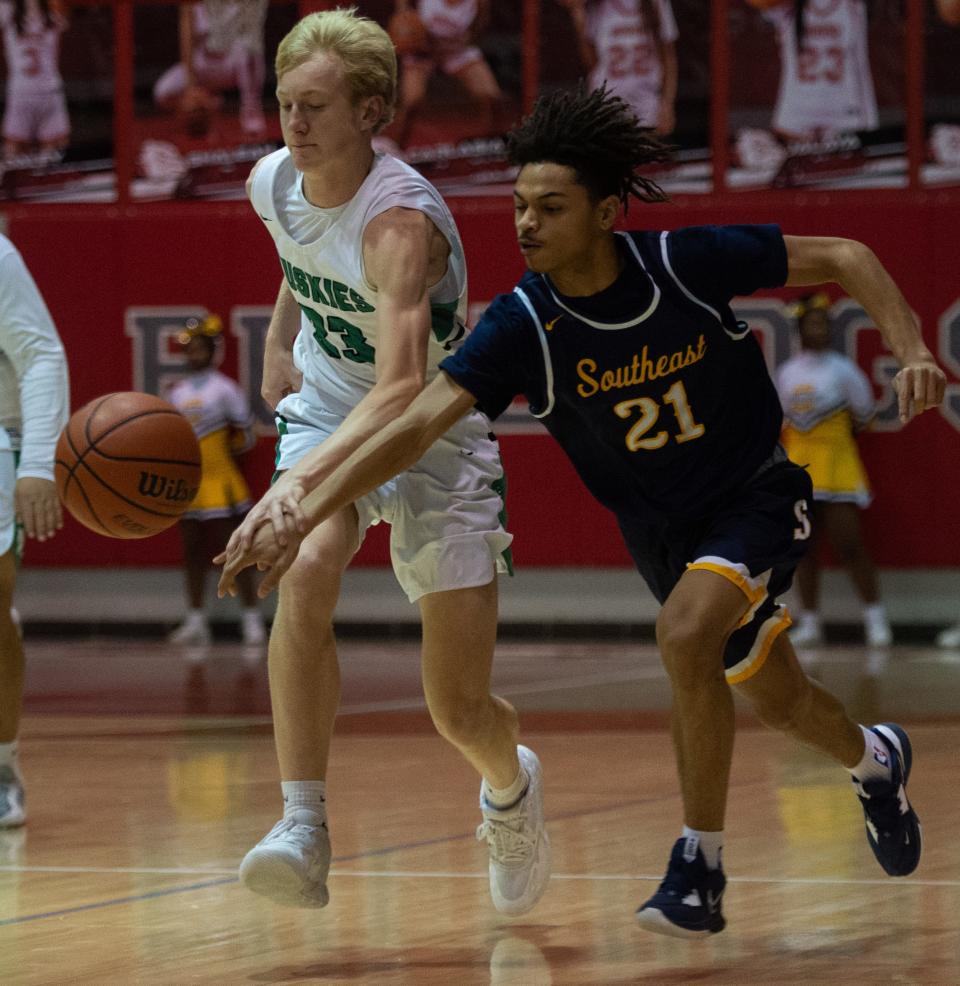 North’s Cayden Gehlhausen (33) defends the ball from Springfield Southeast’s Justin Douglas (21) during the Bosse Winter Classic at Bosse High School in Evansville, Ind., Saturday afternoon, Dec. 17, 2022. 