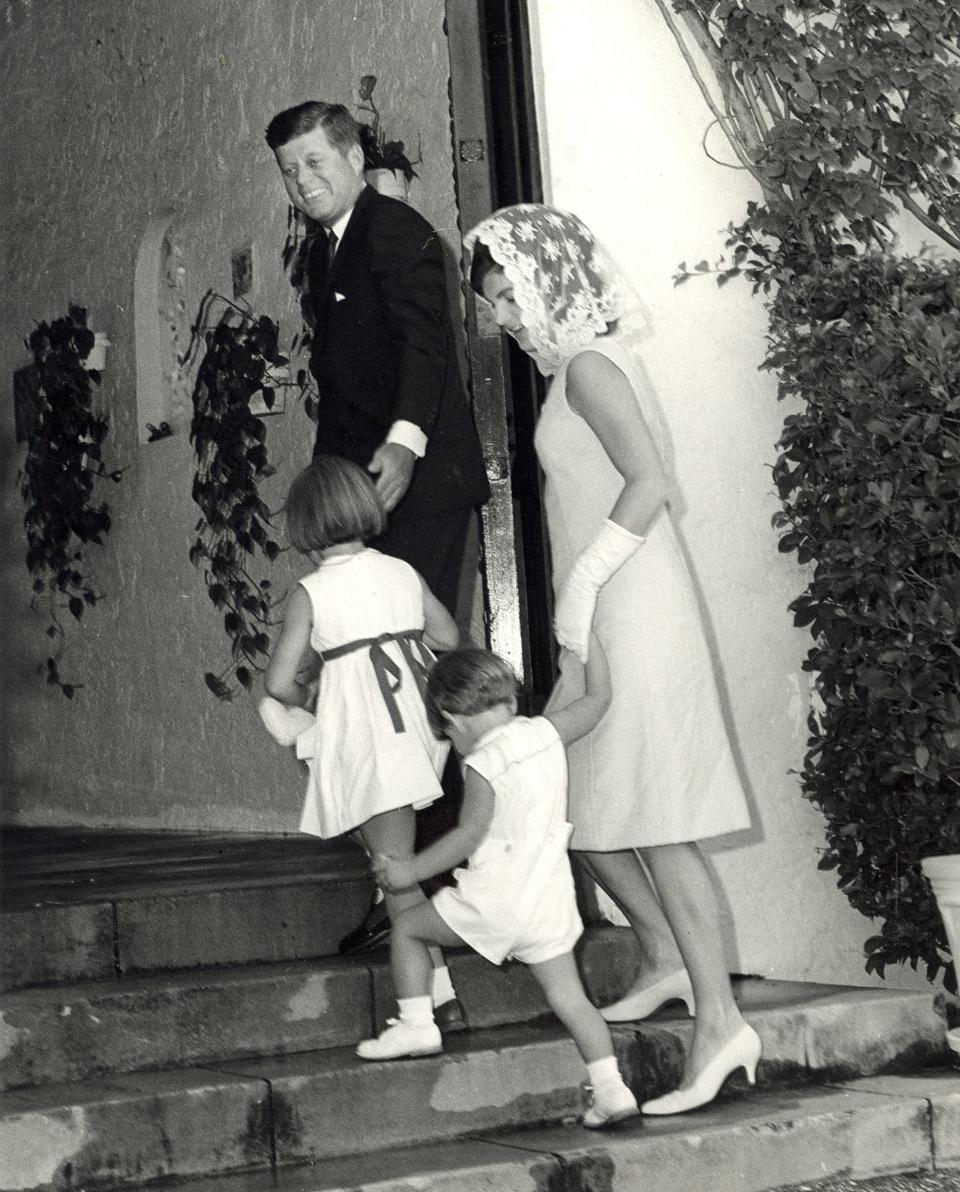 JFK, Jackie and their two young children before Easter Mass at St. Edward Catholic Church in 1963.