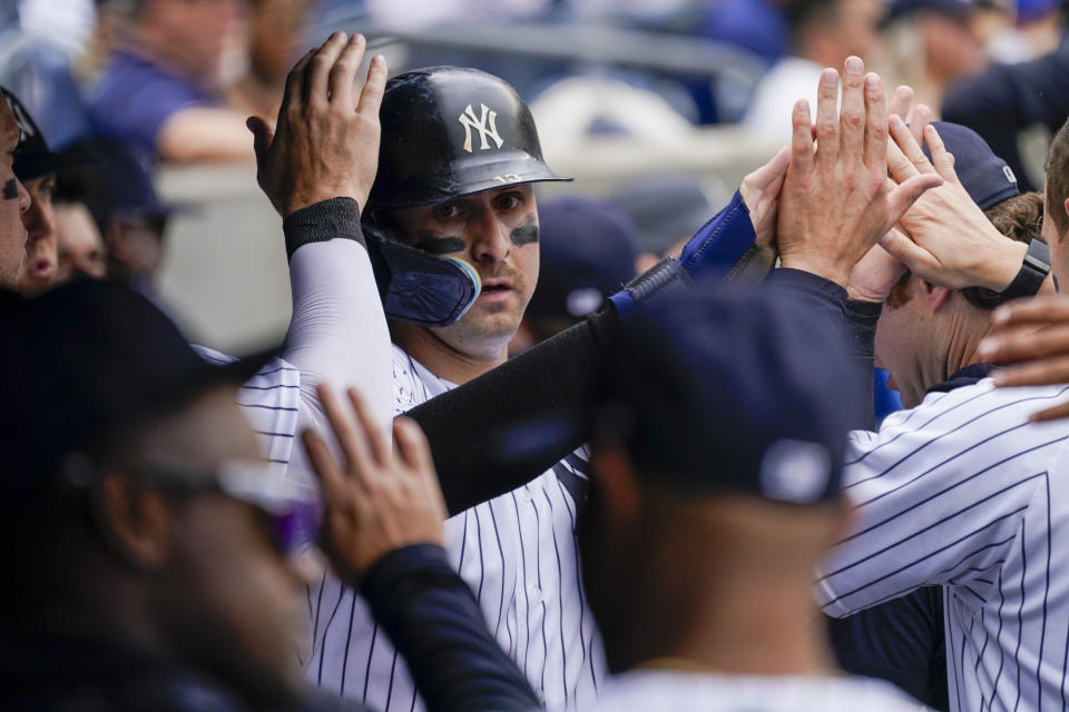 New York Yankees' Joey Gallo celebrates after scoring off an RBI-double by Giancarlo Stanton in the third inning of a baseball game against the Chicago Cubs, Sunday, June 12, 2022, in New York. (AP Photo/Mary Altaffer)