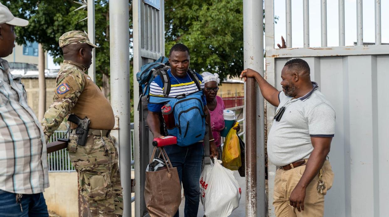 Haitians deported from the Dominican Republic head back across the border. <a href="https://www.gettyimages.com/detail/news-photo/photo-taken-from-haiti-shows-haitians-deported-from-news-photo/1679819363?adppopup=true" rel="nofollow noopener" target="_blank" data-ylk="slk:Steven Aristil/Anadolu Agency via Getty Images;elm:context_link;itc:0;sec:content-canvas" class="link ">Steven Aristil/Anadolu Agency via Getty Images</a>