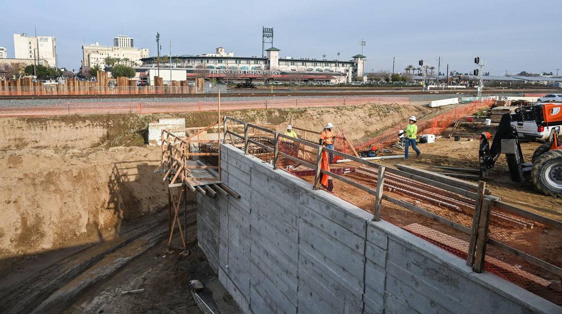 California High-Speed Rail construction continues on the Tulare Street underpass in Fresno’s Chinatown on Thursday, Dec. 8, 2022. Muralist Mauro Carrera is working on a project nearby with the Fresno Arts Council and the California High-Speed Rail Authority.