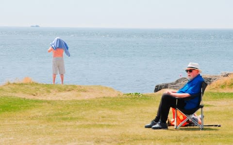 People enjoy a glorious sunny day at Portland Bill in Dorset  - Credit: stuart fretwell/Alamy Live