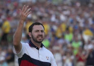 United States' Patrick Cantlay celebrates on the 18th green after winning his afternoon Fourballs match at the Ryder Cup golf tournament at the Marco Simone Golf Club in Guidonia Montecelio, Italy, Saturday, Sept. 30, 2023. (AP Photo/Andrew Medichini)