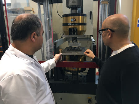 Lancaster University researchers Hasan Hasan and Professor Mohamed Saafi watch carrot-based concrete being stress-tested in their laboratory in Lancaster, Britain, October 2, 2018. Picture taken October 2, 2018. REUTERS/Jim Drury