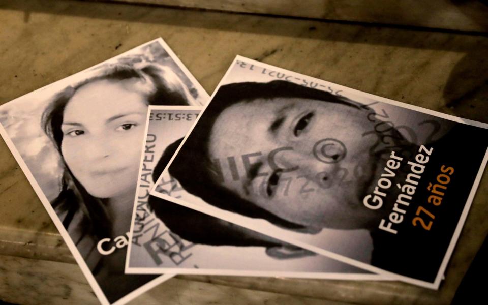 The portraits of two of the victims of a recent massacre by suspected members of the Shining Path guerilla group