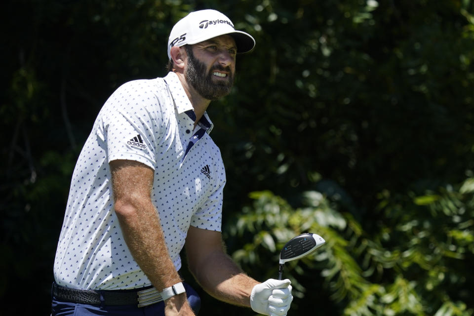 Dustin Johnson watches his tee shot on the sixth hole during the second round of the Charles Schwab Challenge golf tournament at the Colonial Country Club in Fort Worth, Texas, Friday, June 12, 2020. (AP Photo/David J. Phillip)