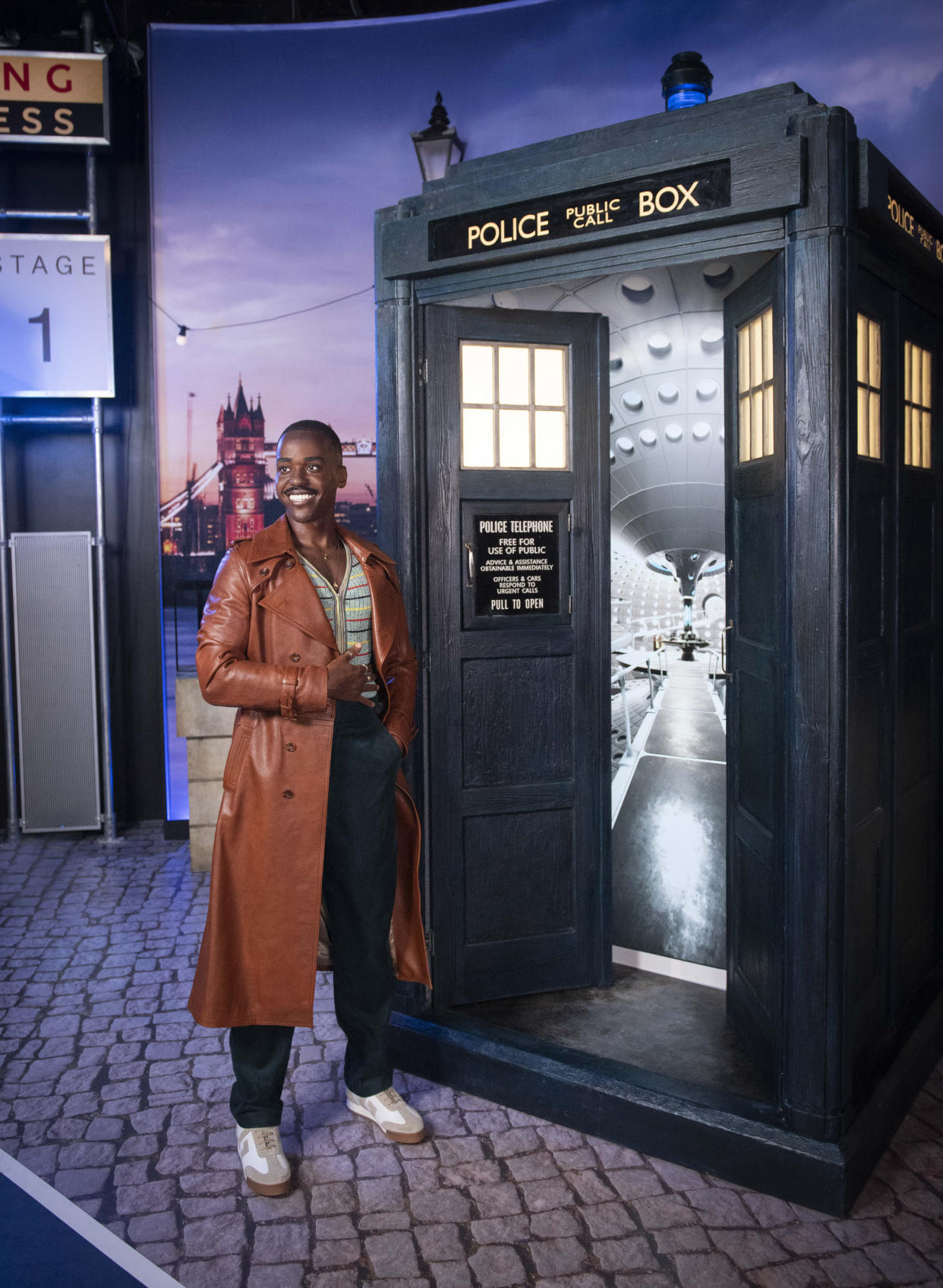 Ncuti Gatwa waxwork next to Tardis at Madame Tussauds 