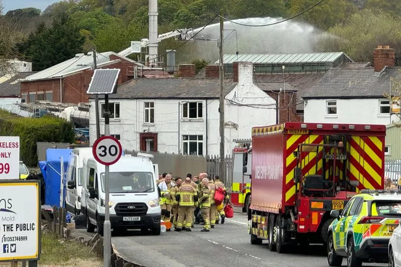 A North Wales fire & Rescue aerial platform is being used to control the blaze