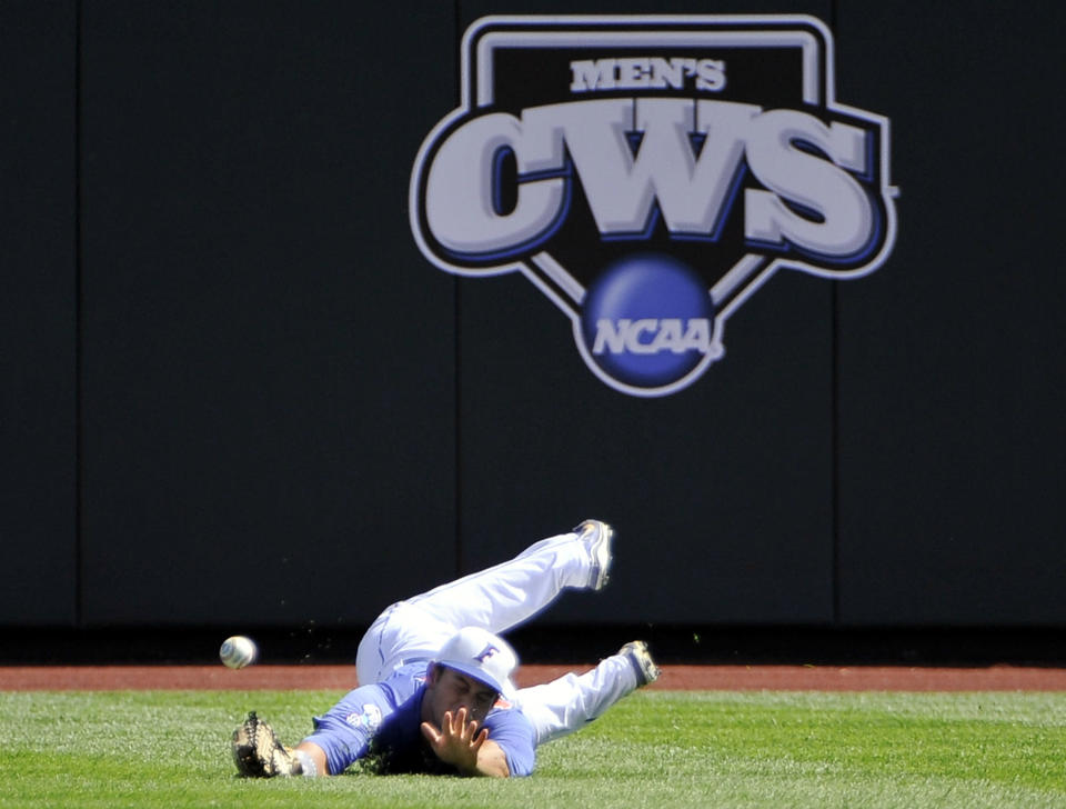 Florida right fielder Preston Tucker can't reach an RBI single by Kent State's George Roberts in the first inning of an NCAA College World Series elimination baseball game in Omaha, Neb., Monday, June 18, 2012. Jimmy Rider scored on the play. (AP Photo/Eric Francis)