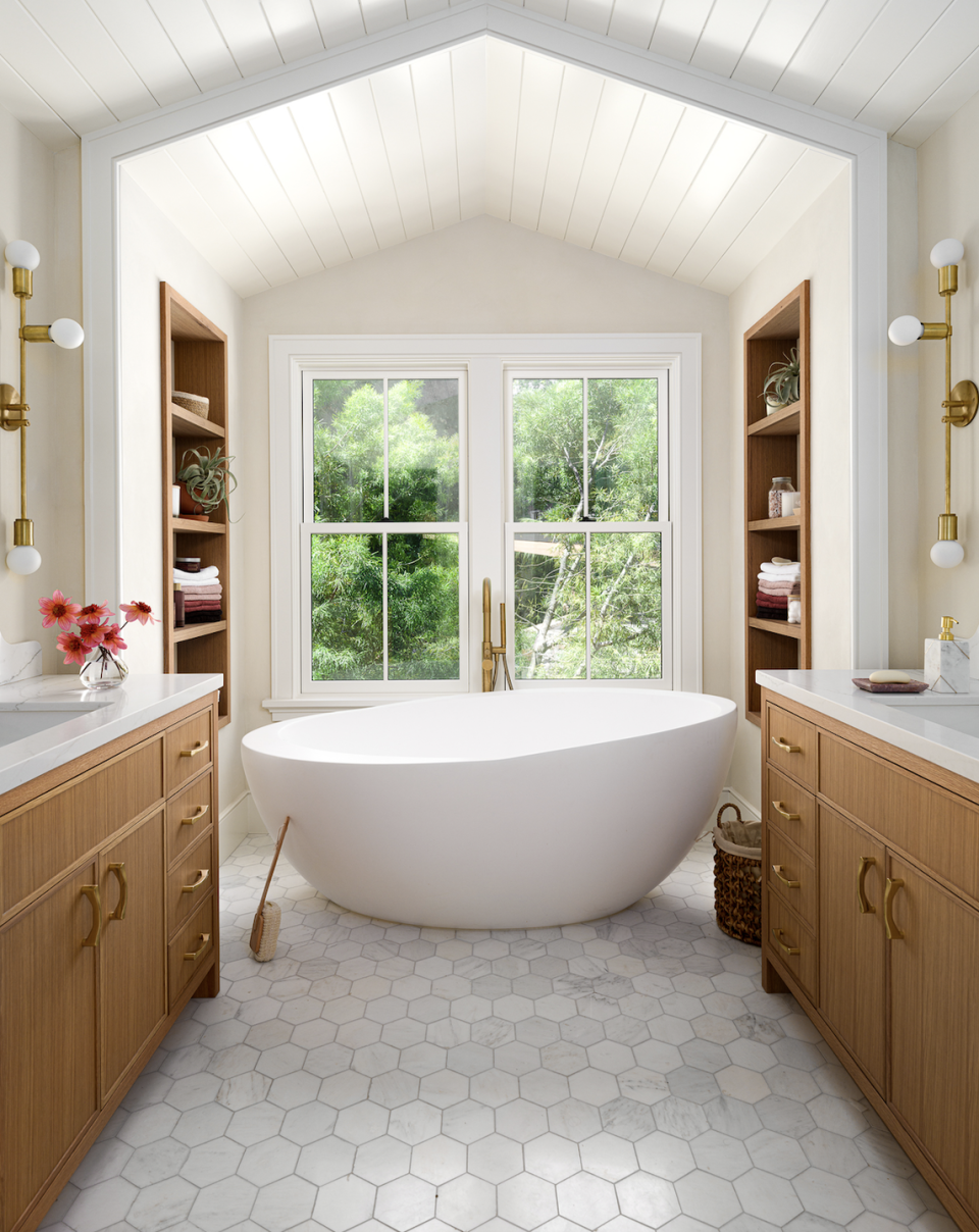 a large white tub in a bathroom