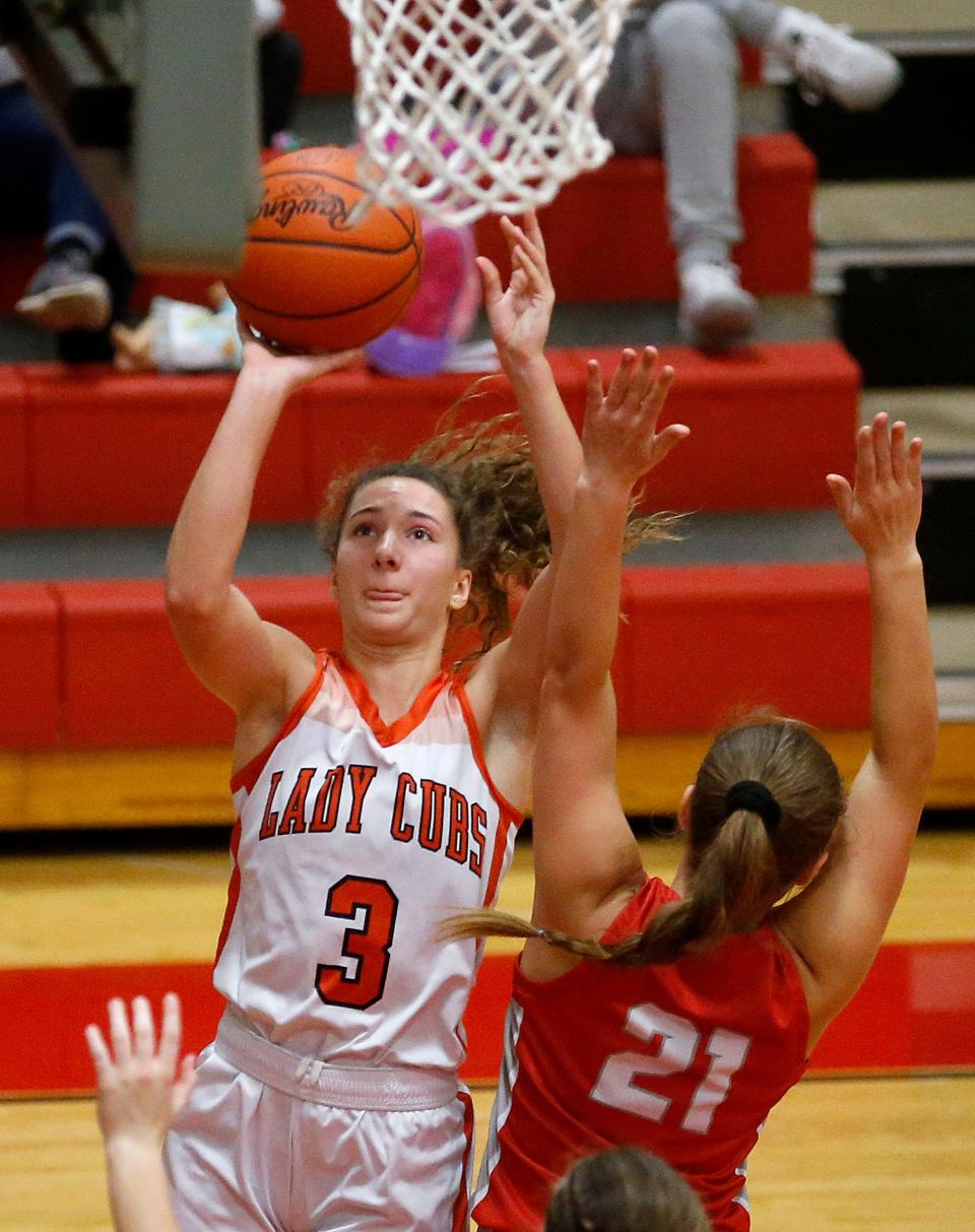 Lucas High School's Shelby Grover (3) puts up a shot against Plymouth High School's Autumn Wilson (21) during their Division IV Northwest District sectional high school girls basketball game at Crestview High School Thursday, Feb. 16, 2023. TOM E. PUSKAR/NEWS JOURNAL