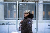 George Floyd's girlfriend Courtney Ross leaves the U.S. Federal Courthouse after the first day of testimony in the federal trial of three former Minneapolis police officers implicated in Floyd's death on Monday, Jan. 24, 2022, in St. Paul, Minn. (Renée Jones Schneider/Star Tribune via AP)