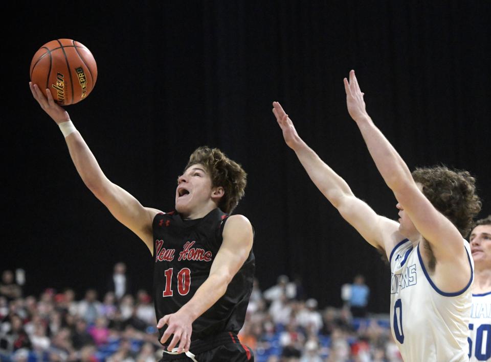 New Home's Brazos Beck goes for a layup against Lipan in a boys Class 2A state semifinal, Friday, March 8, 2024, at the Alamodome in San Antonio.