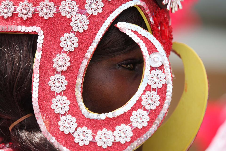 A performer walks through the streets during Lagos Carnival in Lagos, Nigeria, Monday, April 1, 2013. Performers filled the streets of Lagos' islands Monday as part of the Lagos Carnival, a major festival in Nigeria's largest city during Easter weekend. (AP Photo/Sunday Alamba)