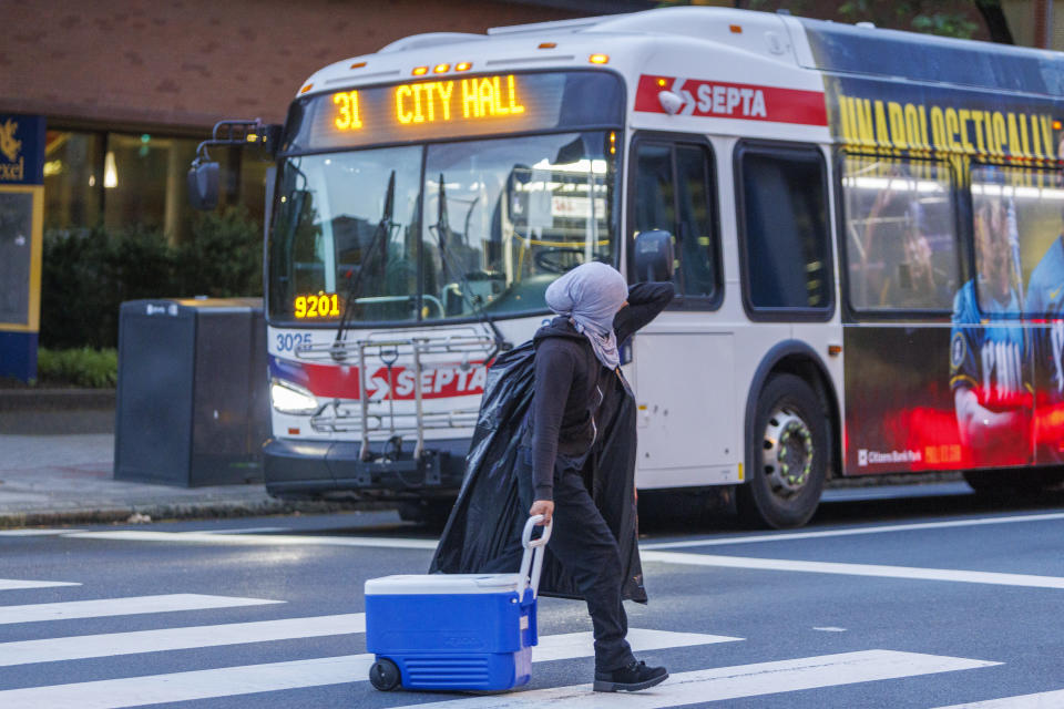 A pro-Palestinian protester crosses Market Street after leaving the Drexel University encampment early Thursday, May 23, 2024 in Philadelphia. (Alejandro A. Alvarez/The Philadelphia Inquirer via AP)