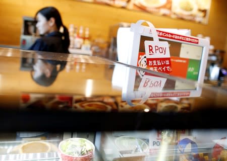 A campaign advertising of Rakuten Pay, QR code mobile payment system operated by Rakuten, is displayed at a coffee shop in Tokyo