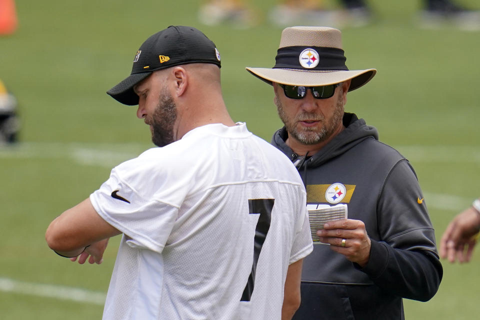 Pittsburgh Steelers quarterback Ben Roethlisberger (7) and offensive coordinator Matt Canada talk during the team's NFL mini-camp football practice in Pittsburgh, Tuesday, June 15, 2021. (AP Photo/Gene J. Puskar)