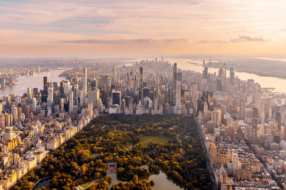 Aerial view of New York City skyline with Central Park in the foreground, showcasing urban and natural landscapes