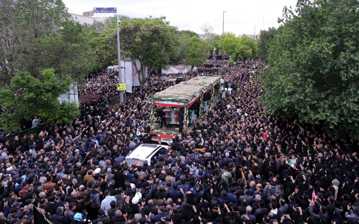 Iranian citizens march from Shohada Square to Mosalla Square during the funeral ceremony