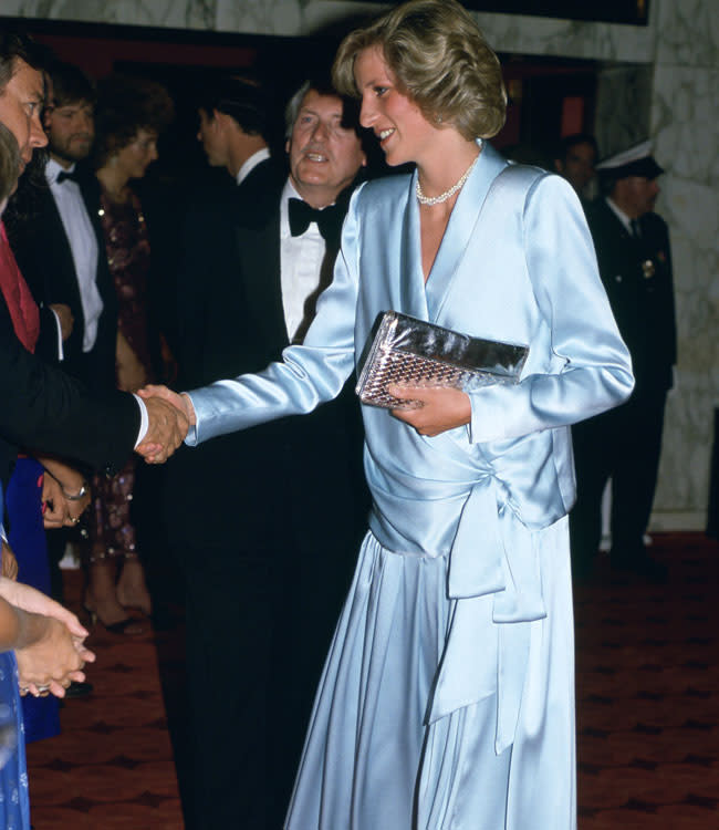 LONDON, UNITED KINGDOM - JUNE 11: Diana, Princess Of Wales, Pregnant With Her Second Son, Prince Harry, Attending The Film Premiere Of 'Indiana Jones And The Temple of Doom' In Leicester Square Just Weeks Before His Birth. She is wearing a pale blue Catherine Walker gown. (Photo by Tim Graham/Getty Images)