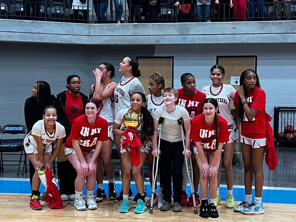 Colleyville Heritage basketball celebrates an area round win over Brewer at Arlington ISD Athletic Center on Feb. 15, 2024.