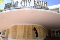 <p>Edward Pastrana installs wood shutters at the Miami City Ballet in Miami Beach, Fla., Thursday, Sept. 7, 2017. The National Hurricane Center issued a hurricane watch for the Florida Keys and parts of South Florida. Mandatory evacuations were issued for the Florida Keys and coastal areas in South Florida. (Photo: Marta Lavandier/AP) </p>