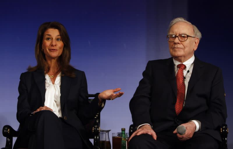 Melinda Gates, left, wife of Microsoft founder and billionaire philanthropist Bill Gates, speaks during a press conference as Billionaire investor Warren Buffett looks on in New Delhi, India, Thursday, March 24, 2011. Billionaire philanthropists Bill Gates and Buffett urged India's tycoons on Thursday to give up some of their newfound wealth to help the country's hundreds of millions of impoverished people. (AP Photo/ Mustafa Quraishi)