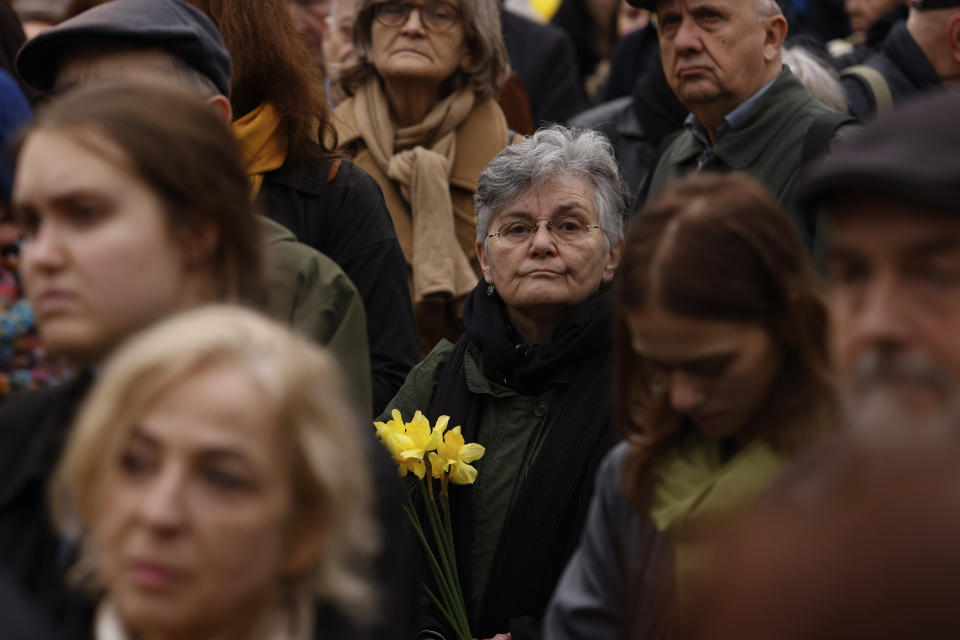 People attend personal unofficial observances marking the 80th anniversary of the Warsaw Ghetto Uprising in Warsaw, Poland, Wednesday, April 19, 2023. (AP Photo/Michal Dyjuk)