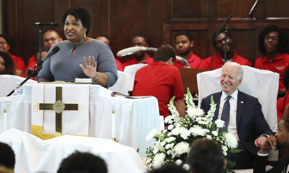 Abrams speaks at Brown Chapel African Methodist Episcopal Church in Selma, as Joe Biden looks on.