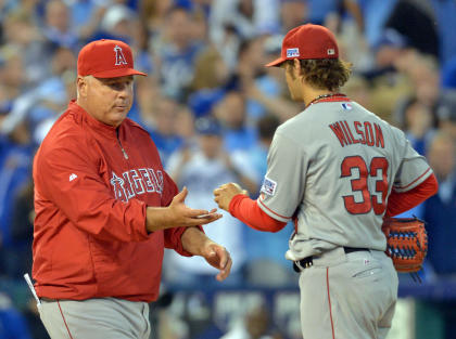 C.J. Wilson (right) lasted only 2/3 of an inning in Game 3. (USA Today)