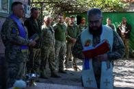 Ukrainian service members celebrate an Orthodox Easter near a front line in Donetsk region