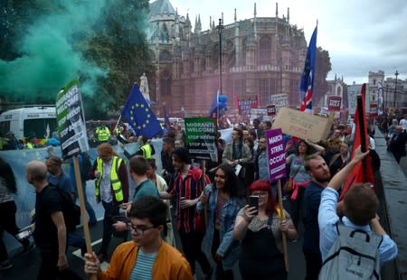 Anti-Brexit protesters attend a demonstration outside the Houses of Parliament, in London