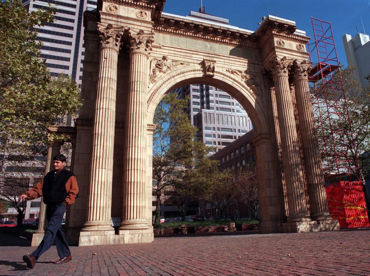 1998 - A man breezes by the Union Station Arch, on Marconi near Hickory downtown which is slated to be moved the Nationwide Arena District.