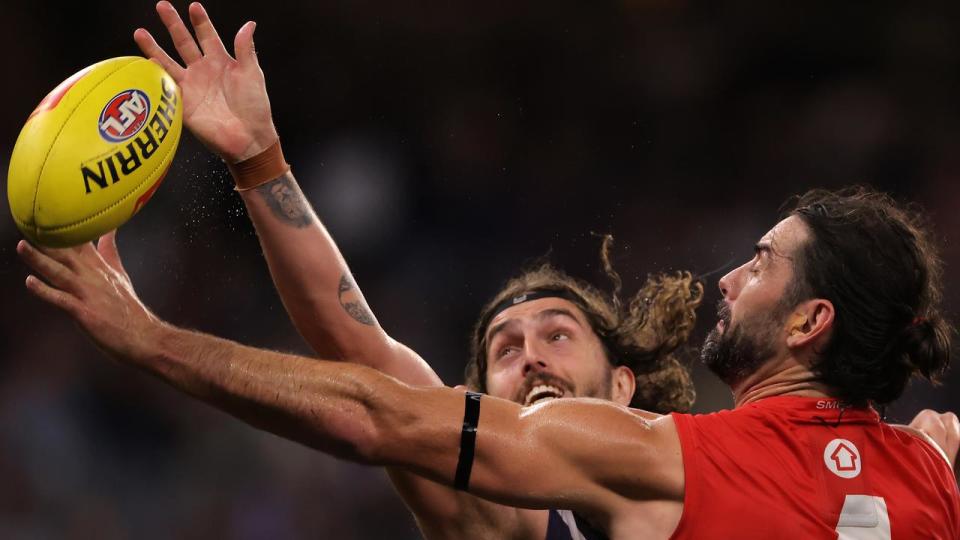 Luke Jackson and Brodie Grundy in a ruck contest.