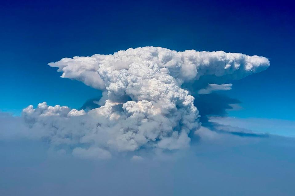In this photo taken with a drone provided by the Bootleg Fire Incident Command, a pyrocumulus cloud, also known as a fire cloud, is seen over the Bootleg Fire in southern Oregon on July 14, 2021.