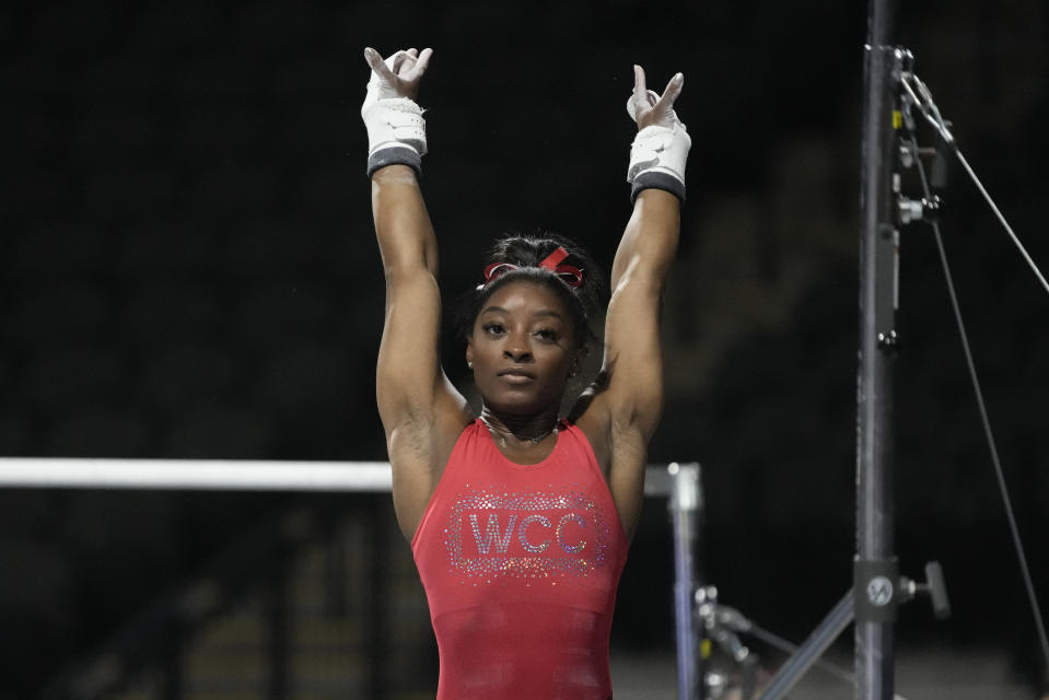 Simone Biles, a seven-time Olympic medalist and the 2016 Olympic champion, practices on the uneven bars at the U.S. Classic gymnastics competition Friday, Aug. 4, 2023, in Hoffman Estates, Ill. (AP Photo/Morry Gash)