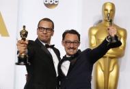 Mat Kirkby and James Lucas pose with their award for best live action short film for "The Phone Call" during the 87th Academy Awards in Hollywood, California February 22, 2015. REUTERS/Lucy Nicholson