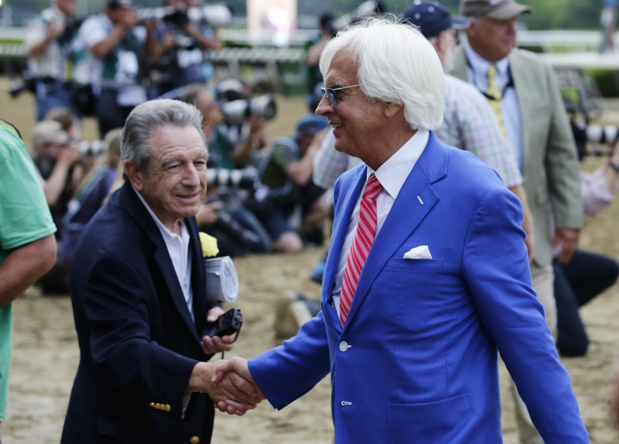 Justify’s trainer, Bob Baffert, is congratulated after Justify won the 150th running of the Belmont Stakes and the Triple Crown on Saturday. (AP)