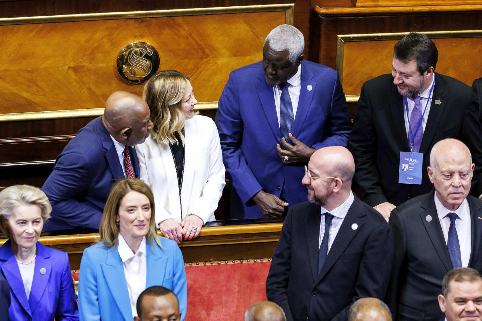 Italian Premier Giorgia Meloni, back row second from left, shares a smile with African Union Commission Chairperson Moussa Faki Mahamat, second from right, Vice President of the Council of Ministers of Italy Matteo Salvini, right, and African Union President Azali Assoumani, left, as front row from left, President of the European Commission Ursula von der Leyen, President of the European Parliament Roberta Metsola, President of the European Council Charles Michel and President of Tunisia Kais Saied stand on, at the Senate for the start of an Italy - Africa summit, in Rome, Monday, Jan. 29, 2024. Meloni opened a summit of African leaders on Monday aimed at illustrating Italy's big development plan for the continent that her government hopes will stem migration flows and forge a new relationship between Europe and Africa. (Roberto Monaldo/LaPresse via AP)