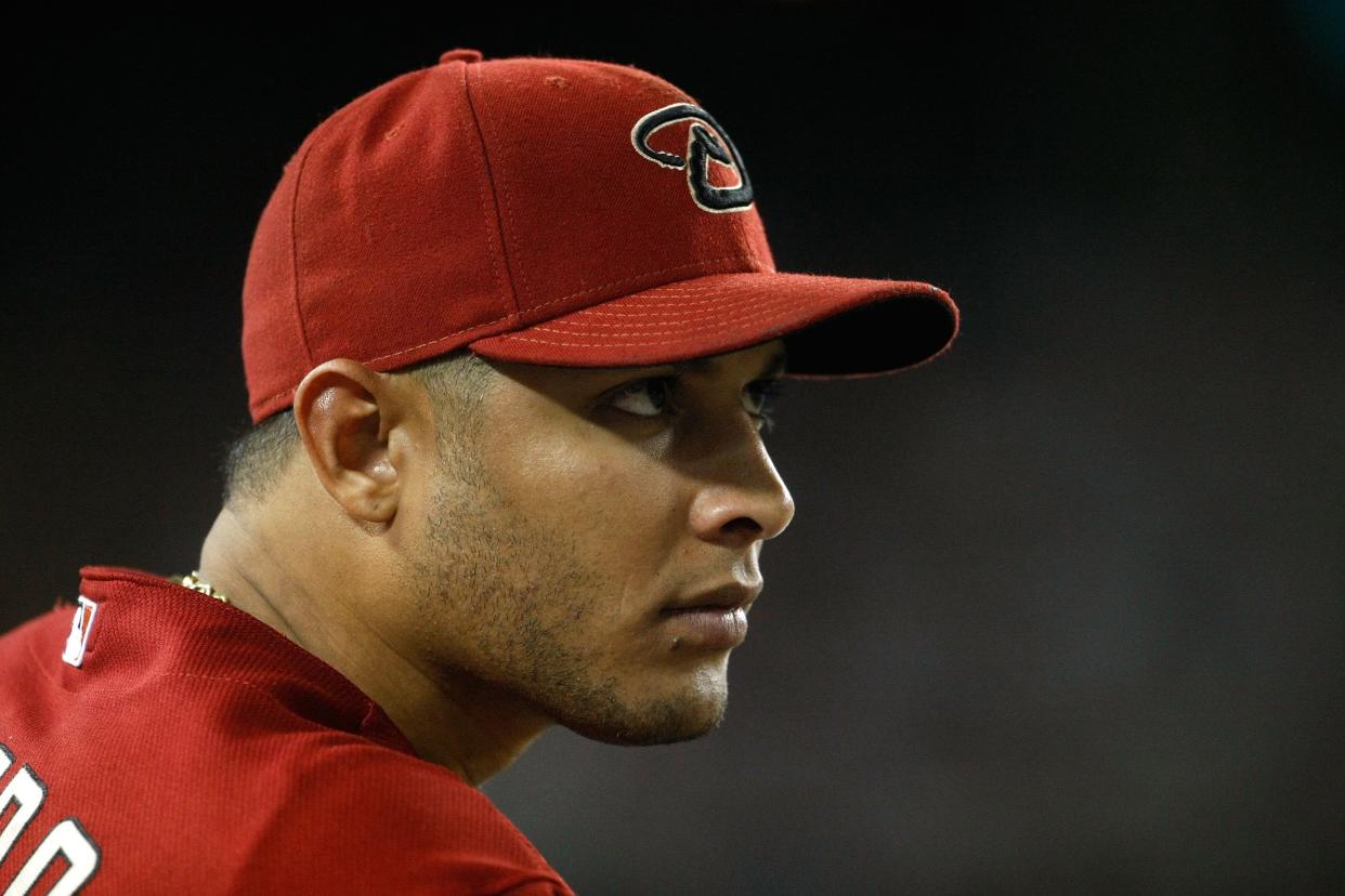 Former MLB outfielder Alex Romero attacks catcher with bat during Venezuelan League game. (Photo by Jeff Gross/Getty Images)