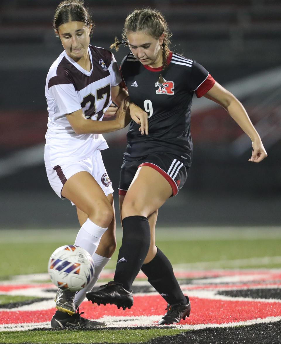 Stow's Sophia Yoder, left, battles with Kent's Sara Yanelli on Monday, Sept. 19, 2022 in Kent.