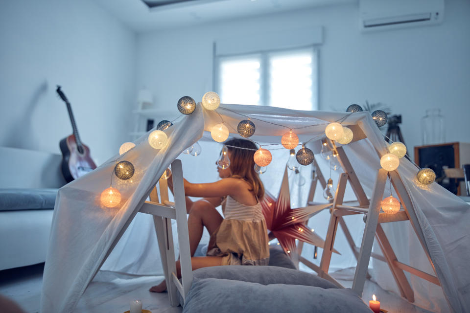 Build a den out of sheets and Christmas lights.(Getty Images)