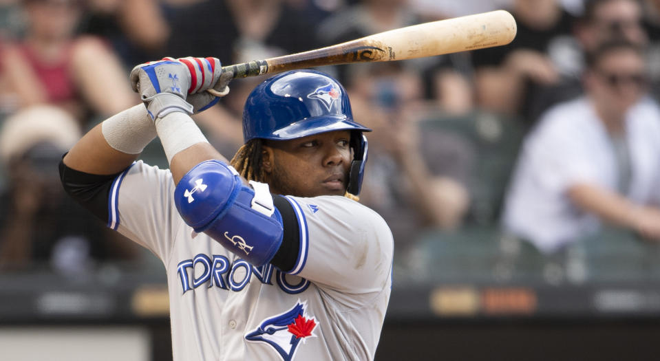 Vladimir Guerrero Jr. of the Toronto Blue Jays left Friday night's game against the Houston Astros after his hand was hit by a fastball. (Photo by Ron Vesely/MLB Photos via Getty Images)