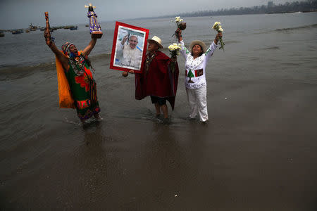 Peruvian shamans perform a ritual prior to the arrival of Pope Francis to Peru, at Pescadores beach in Chorrillos, Lima, Peru January 17, 2018. REUTERS/Guadalupe Pardo