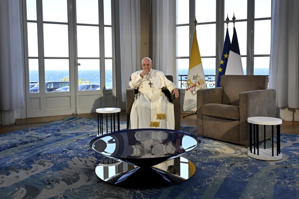Pope Francis waits for the arrival of French President Emmanuel Macron for a bilateral meeting at the Palais du Pharo, in Marseille, France, Saturday, Sept. 23, 2023. Francis, during a two-day visit, will join Catholic bishops from the Mediterranean region on discussions that will largely focus on migration. (Andreas Solaro/AFP via AP, Pool)