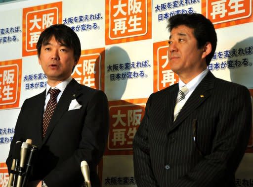 Japan's Osaka Mayor Toru Hashimoto (L), accompanied by Osaka Governor Ichiro Matsui (R), speaks to reporters in Tokyo in April 2012. The 42-year-old former corporate lawyer thinks Japan needs a dictatorship. One survey found 55 percent of voters want his party Osaka Isshin no Kai (Osaka Renewal Party) to win "an influential number of seats" in the next general elections