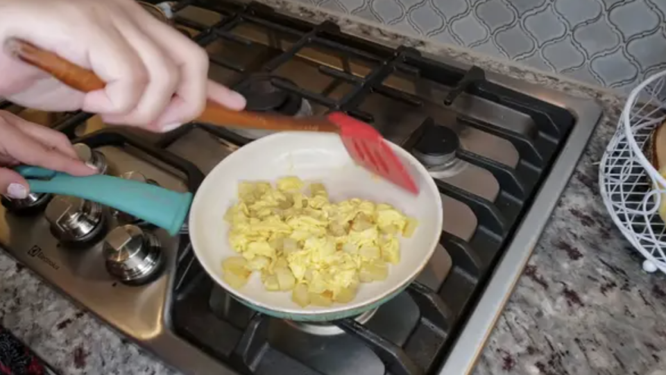 Scrambled eggs being cooked in a pan