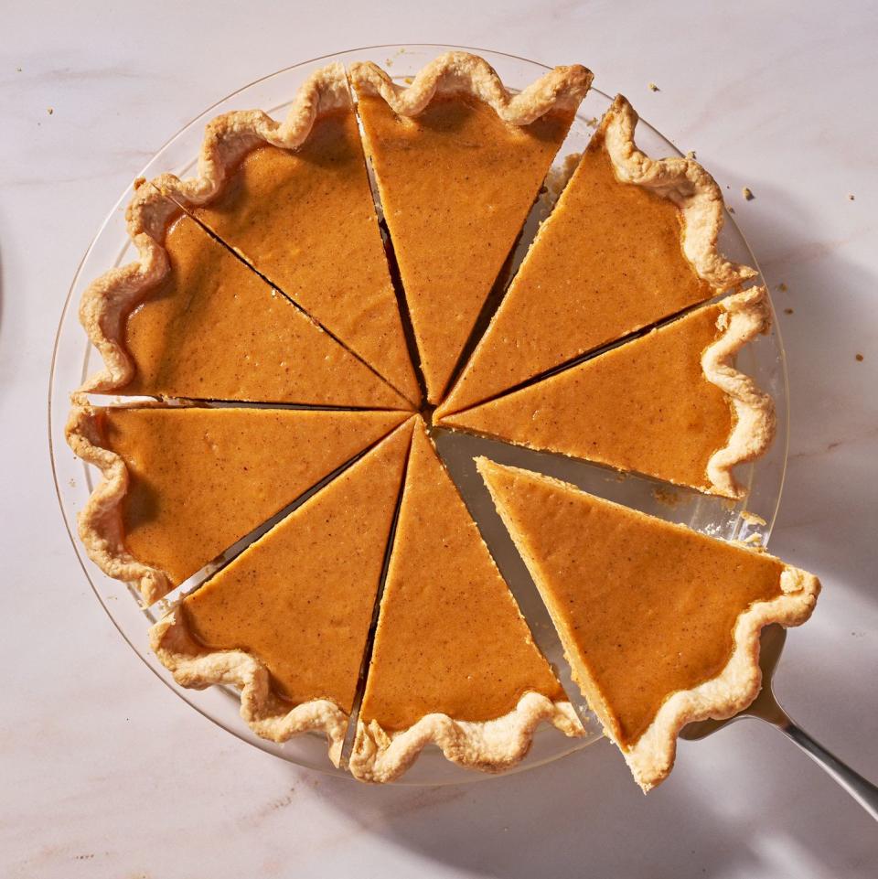 sweet potato pie with a piece coming out of it