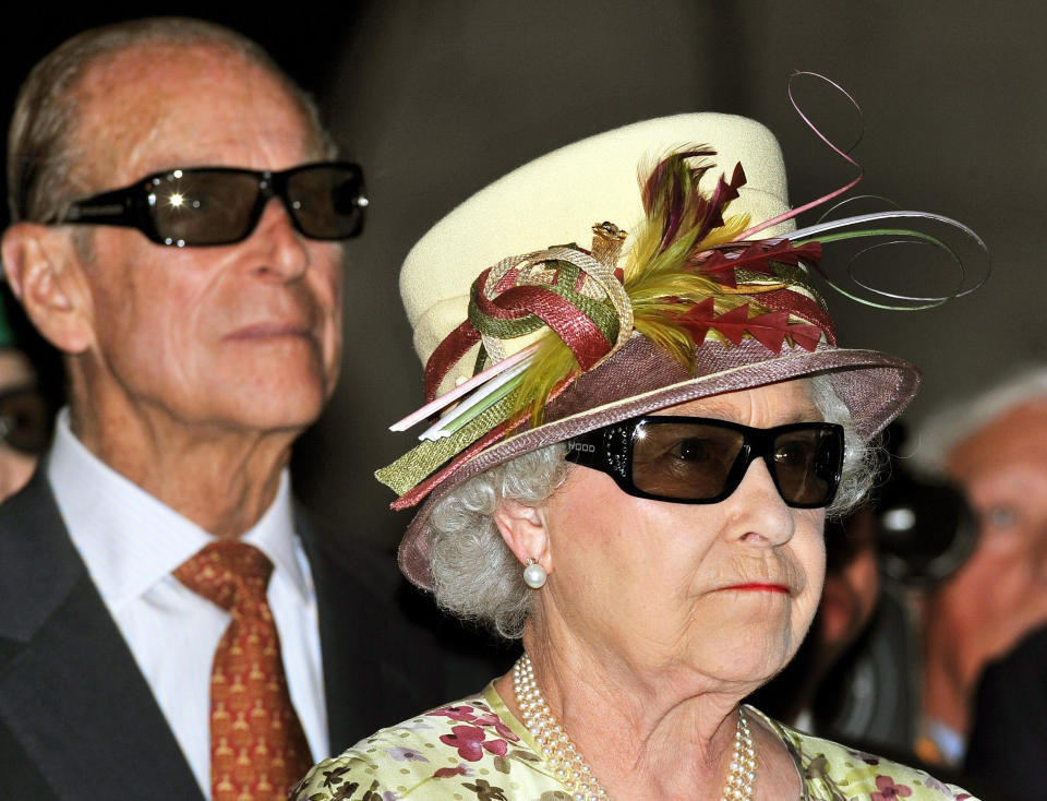 File photo dated 05/07/10 of Queen Elizabeth II and the Duke of Edinburgh wearing 3D glasses to watch a 3D film, at the Pinewood Studios in Toronto, Canada. The Duke of Edinburgh celebrates his 99th birthday Wednesday.